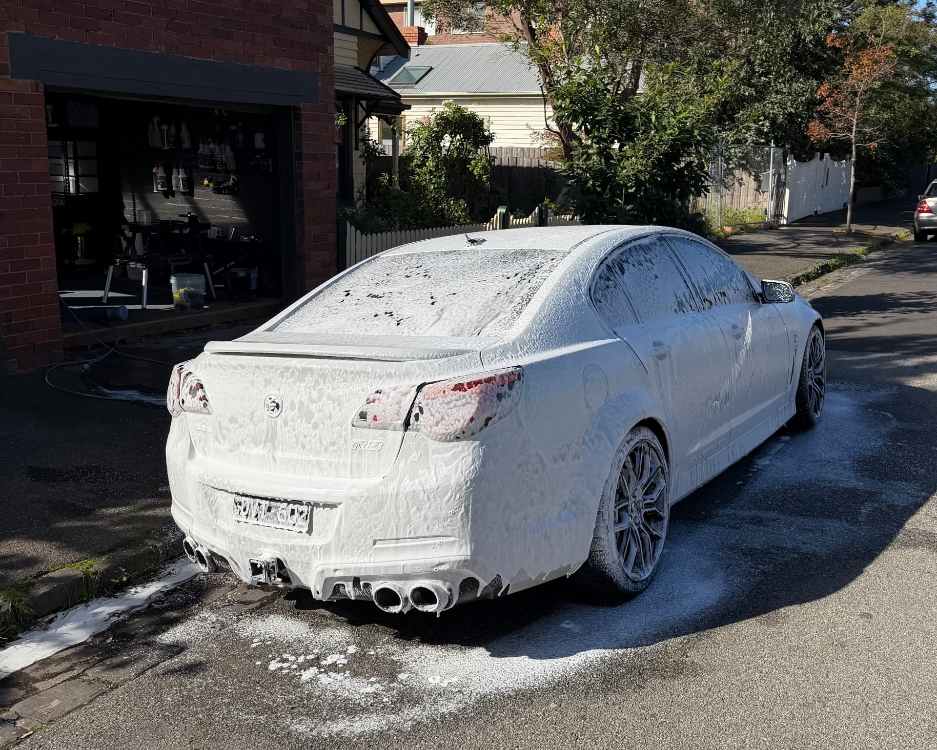 Luxury car exterior being safely hand washed and detailed